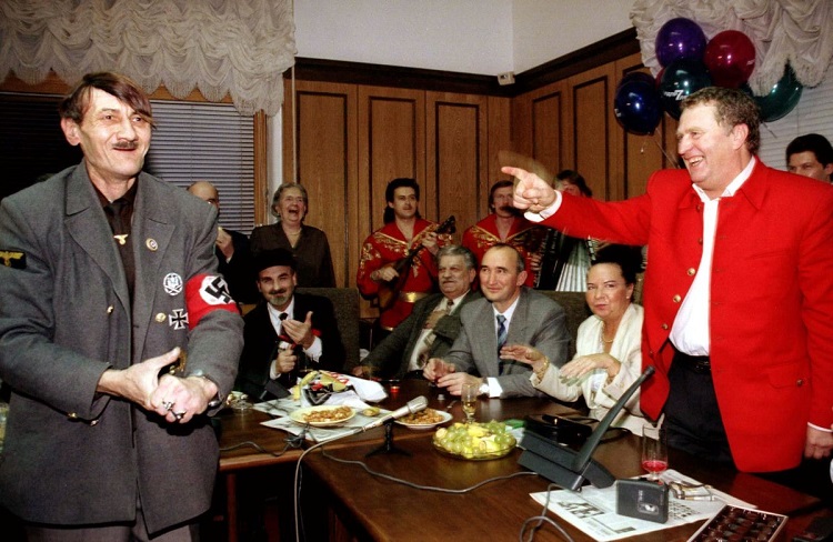 Russian ultranationalist leader Vladimir Zhirinovsky (R) points at a look-alike of Adolf Hitler duri..